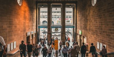 People walking in a train station / CC0 Christian Wiediger